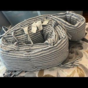 Pottery barn blue and white crib bumper.